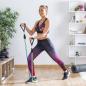 Preview: Frau trainiert mit Innovagoods Tribainer Stretchbändern für Fitness zu Hause